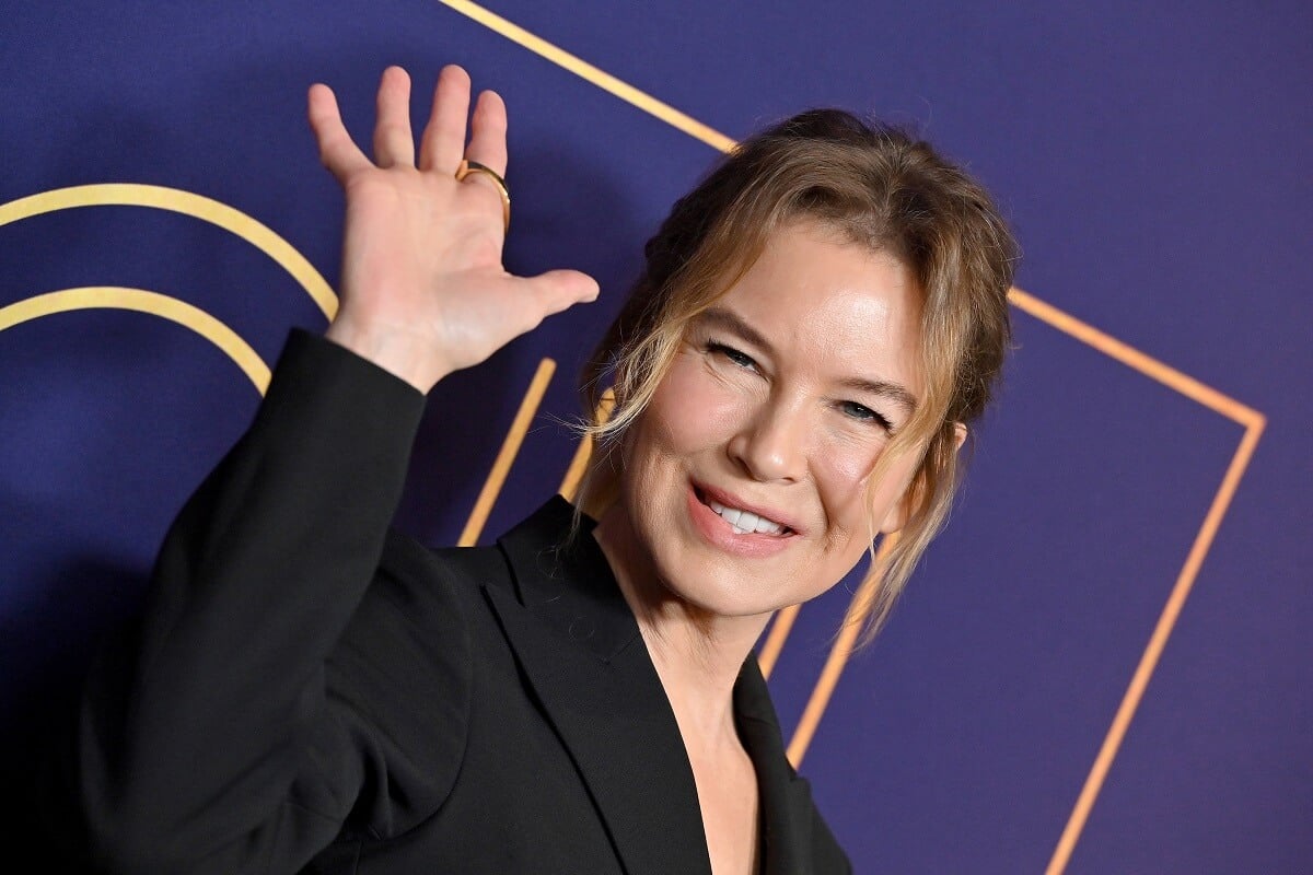 Renee Zellwegger posing in a black suit at NBCUniversal's FYC Event for "The Thing About Pam".