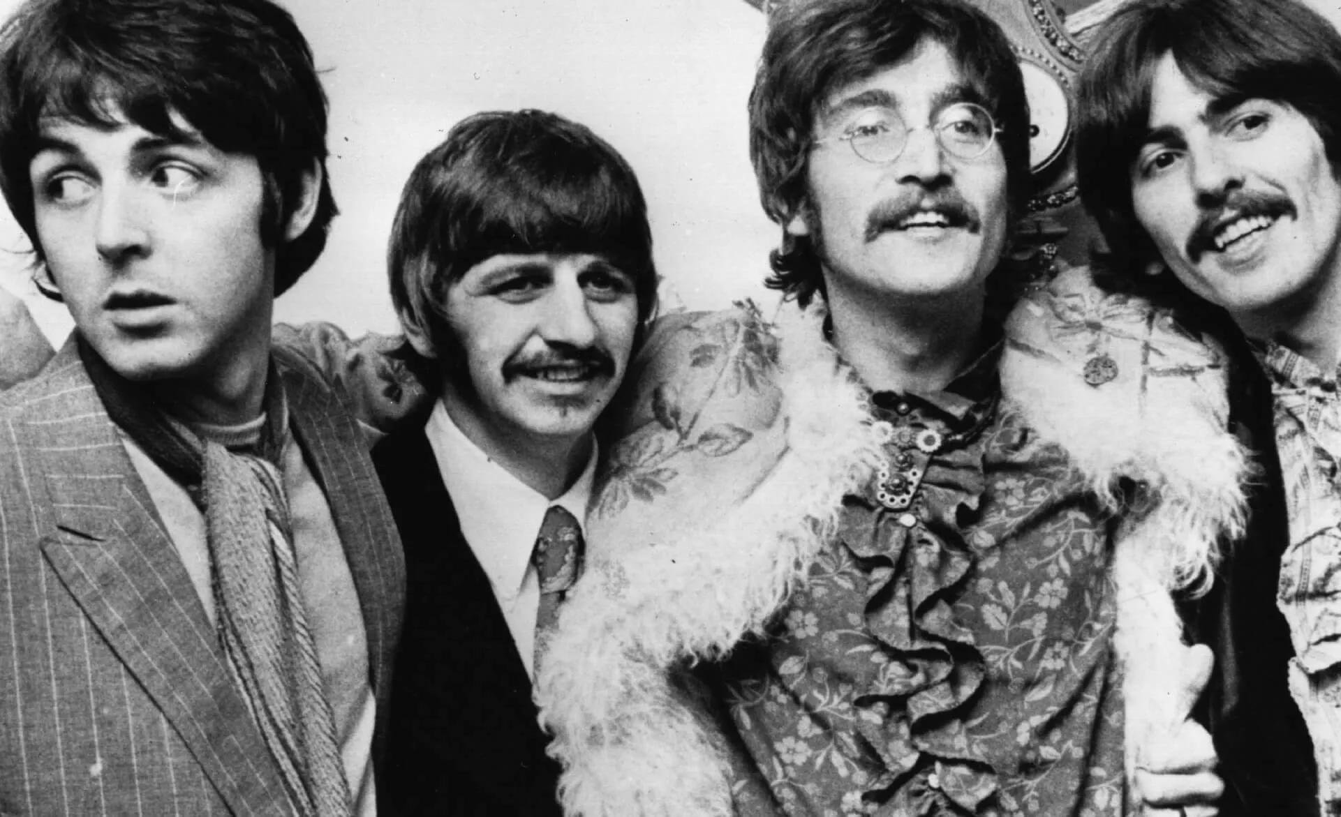 Paul McCartney, Ringo Starr, John Lennon, and George Harrison in black-and-white