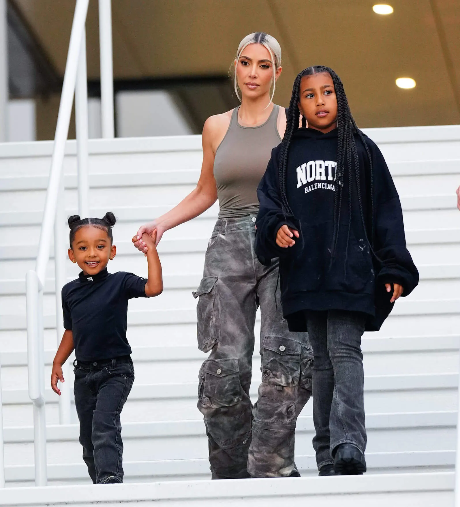 Chicago West, Kim Kardashian, and North West walking together outside the American Dream Mall