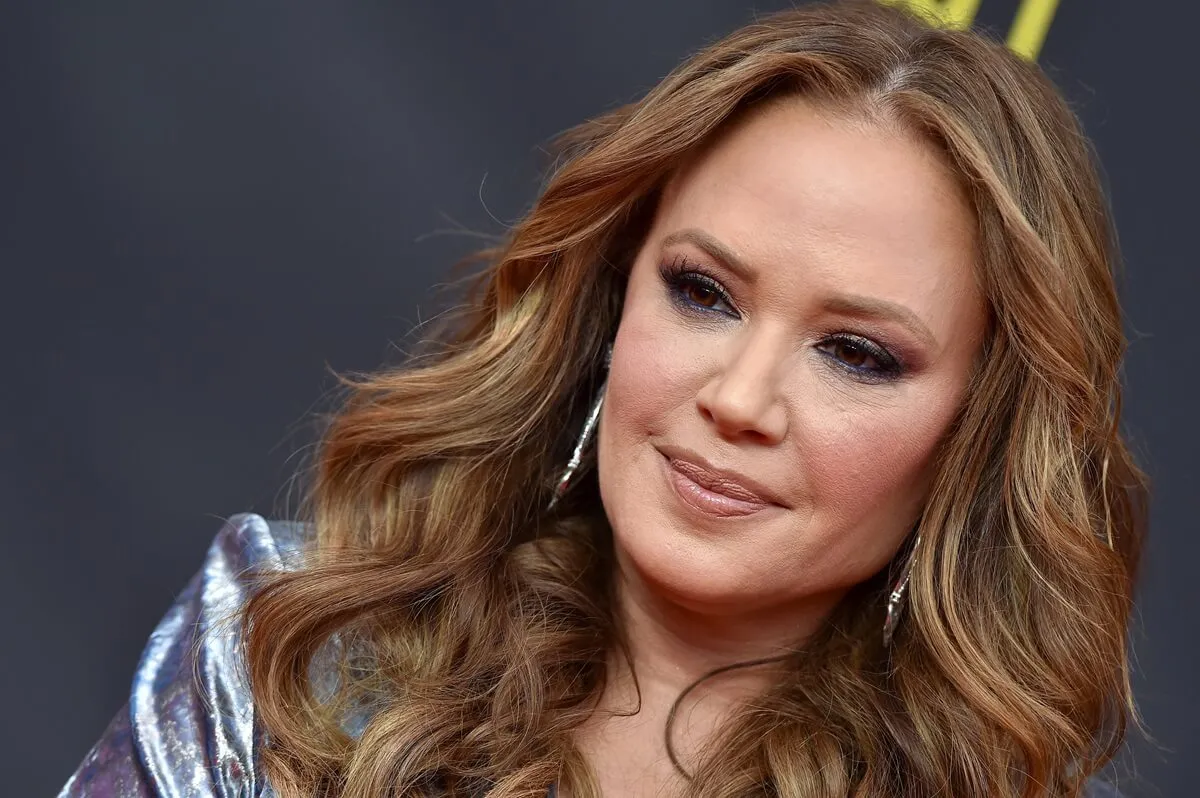 Leah Remini attends the 2019 Creative Arts Emmy Awards while wearing a silver outfit.