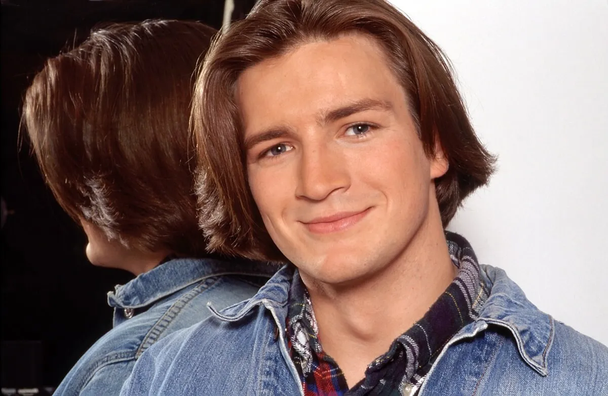 Nathan Fillion smiling in a 'One Life to Live' promotional photo.