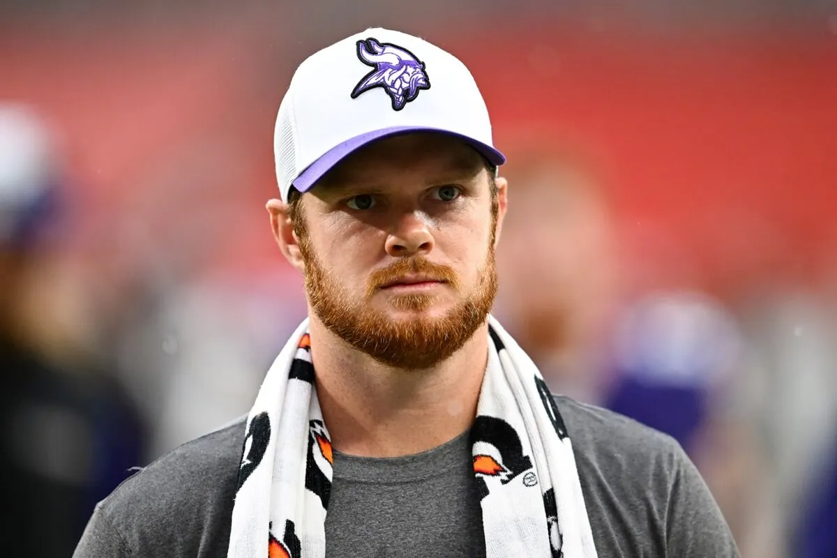 Sam Darnold walks off the field after the Minnesota Vikings win over the Cleveland Browns in a preseason game