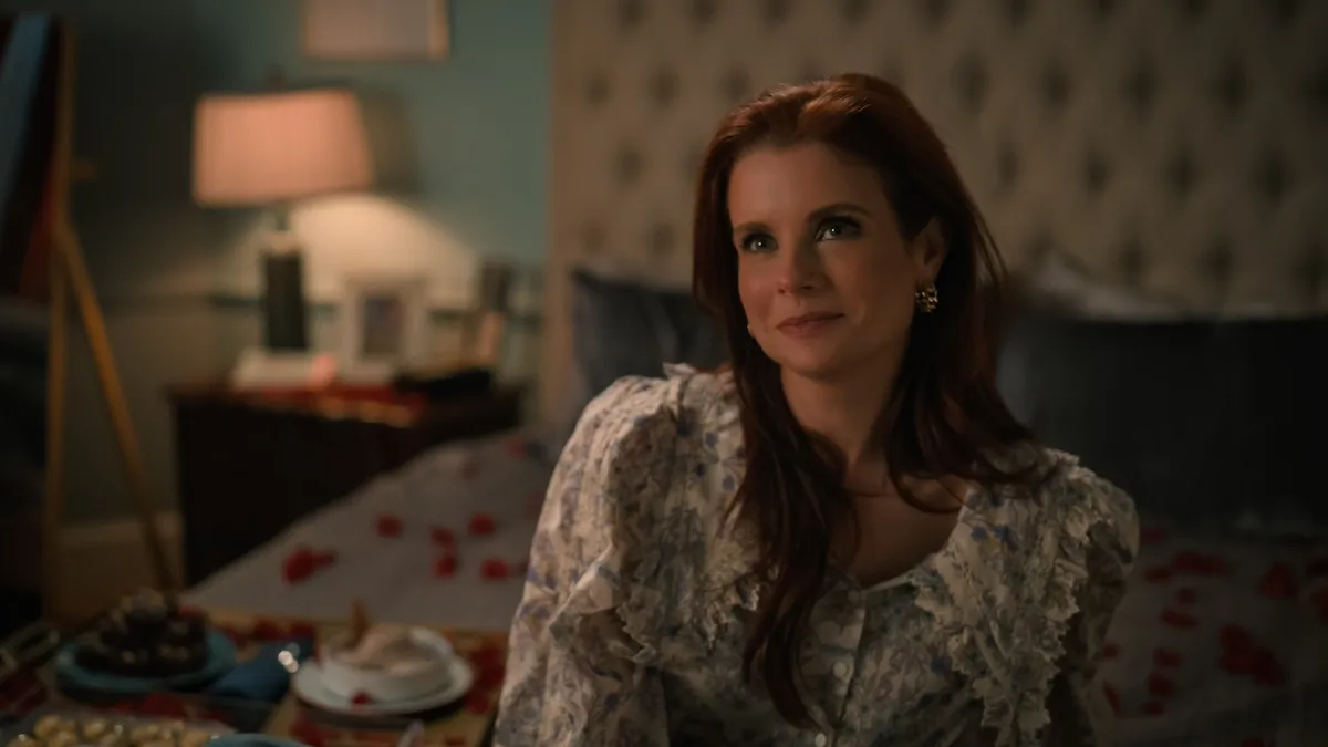 Maddie with red hair and wearing a floral blouse in 'Sweet Magnolias' Season 4